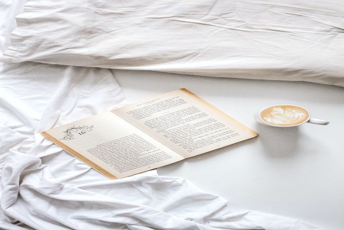 book with latte in bed by unsplash?width=698&height=466&fit=crop&auto=webp