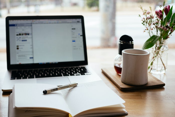 Journal in front of laptop
