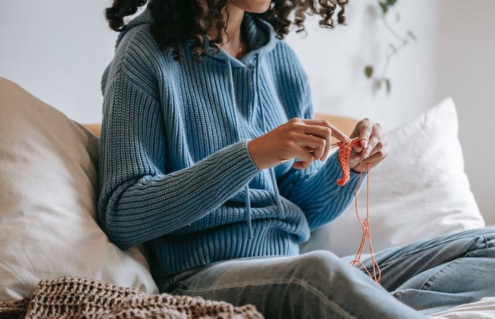 woman crocheting