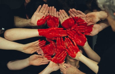 hands forming  a red heart