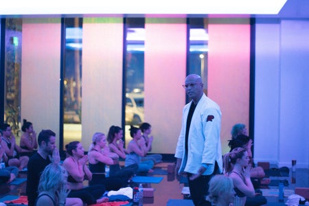 Cidney teaching yoga students