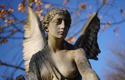\"angel concrete statue photo\" on unsplash