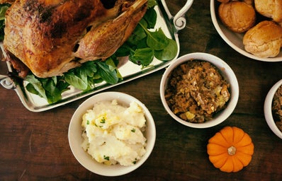 Thanksgiving meal spread with turkey and sides