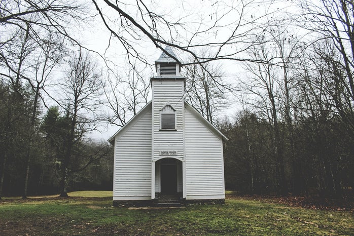 Small white chapel in woods