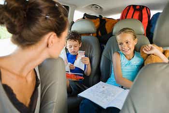Mom entertaining kids in the car