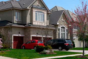 House with two cars parked in the driveway