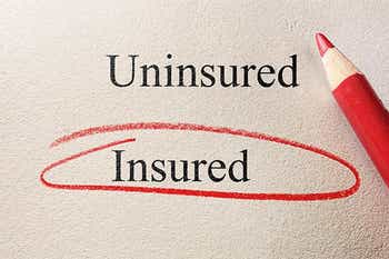 Piece of paper and red pencil with the word insured circled in red