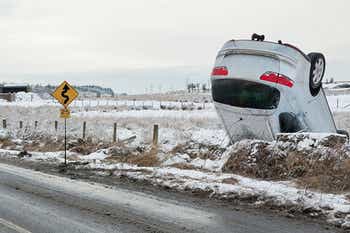 Car overturned on the side of the road