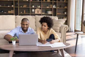 A couple researching renters insurance