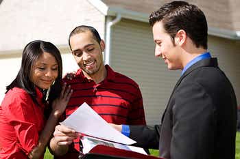 Couple talking with insurance agent