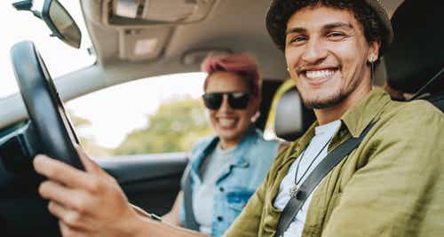 Couple of friends traveling by car