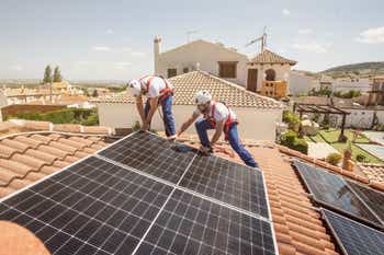 Installation of solar panels on the roof of a house, maintenance and cleaning with vertical works