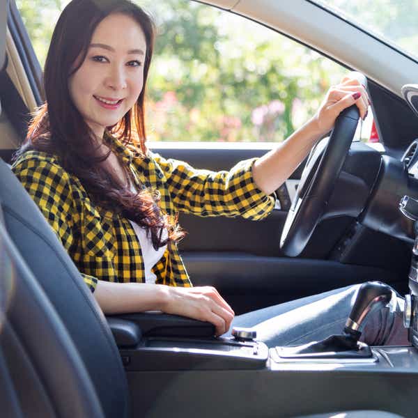 Smiling woman driving in a car