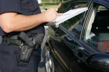 Policeman writing ticket