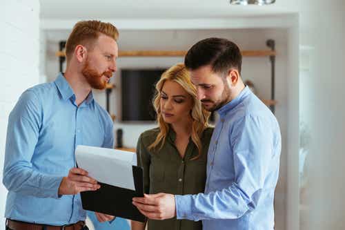 Couple reviewing insurance quote with agent