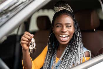 Teenage girl holding keys