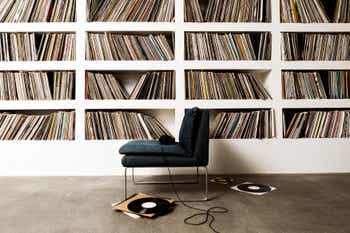 A collection of vinyl records on shelfs