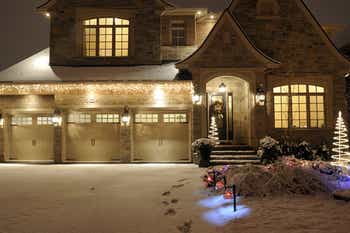 Looking at the front of a large house covered in snow