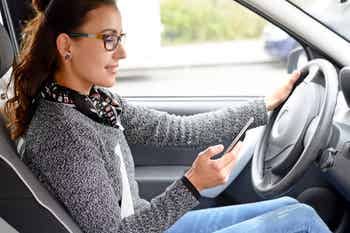 Girl texting while driving