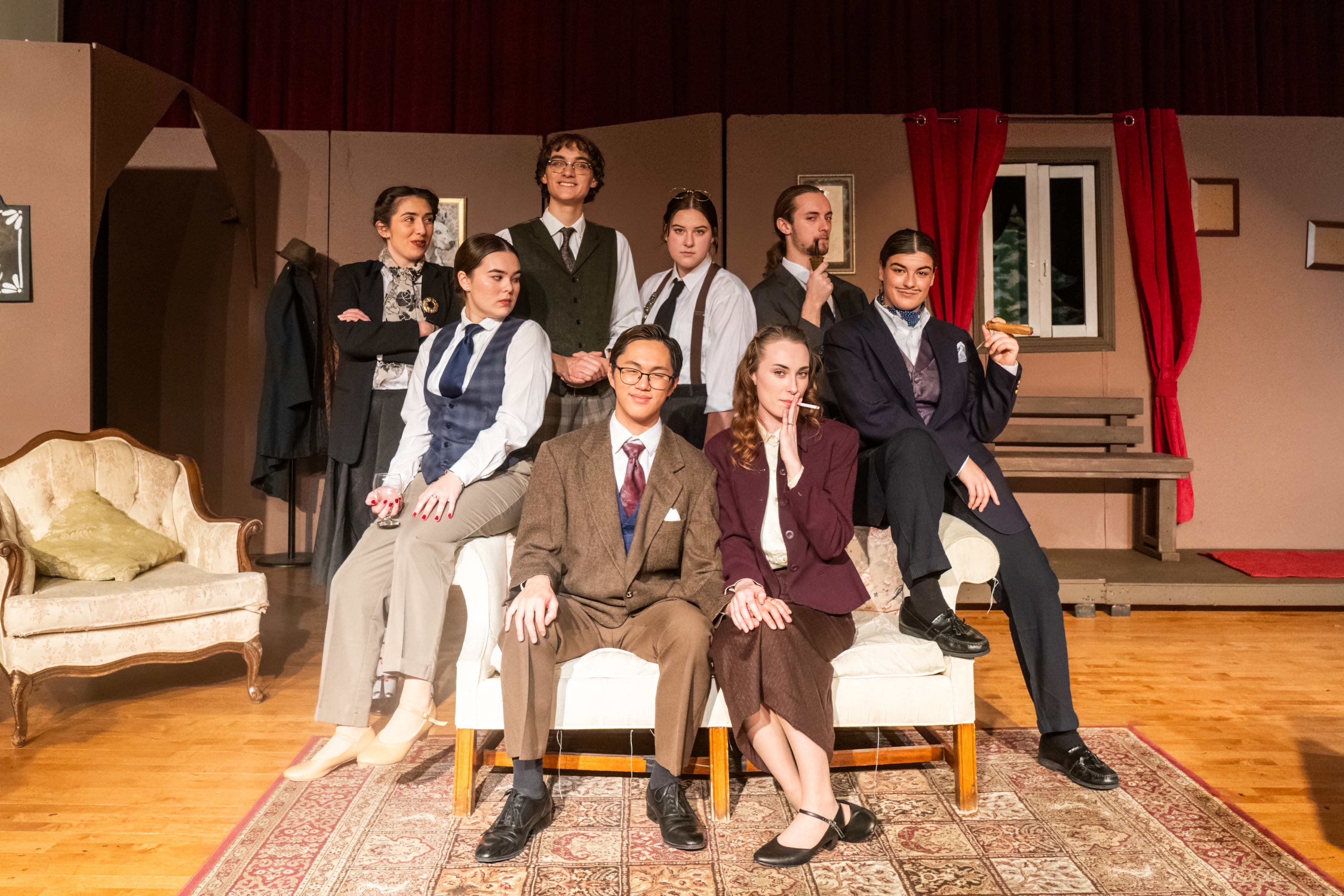 A group photo of students on a couch 