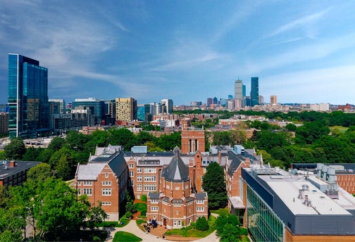 Aerial shot of Emmanuel College campus with Boston skyline in background