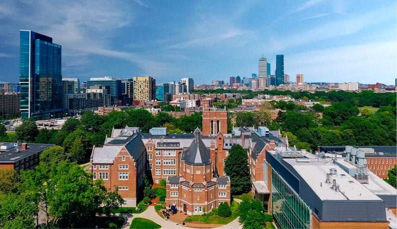 Aerial shot of Emmanuel College campus with Boston skyline in background