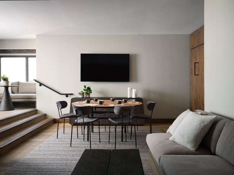Living room area setup with a meeting table