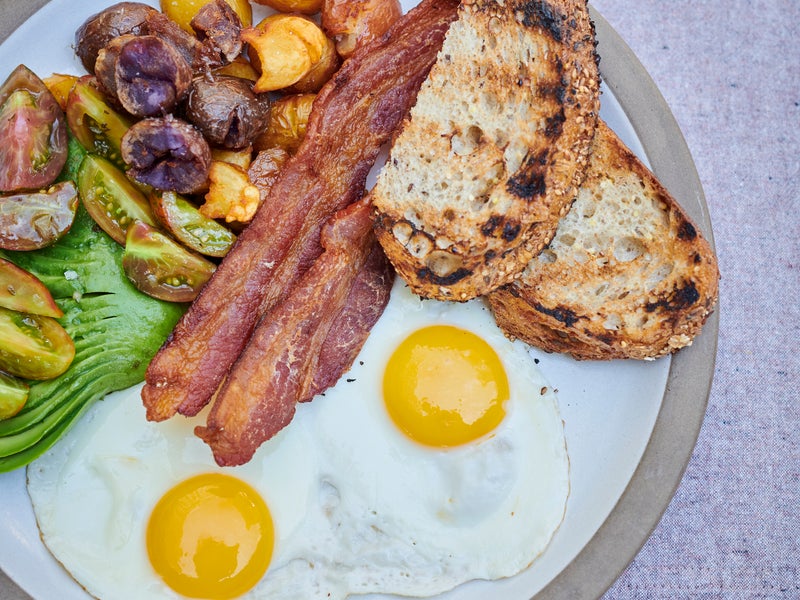 Bacon, eggs and toast on a plate