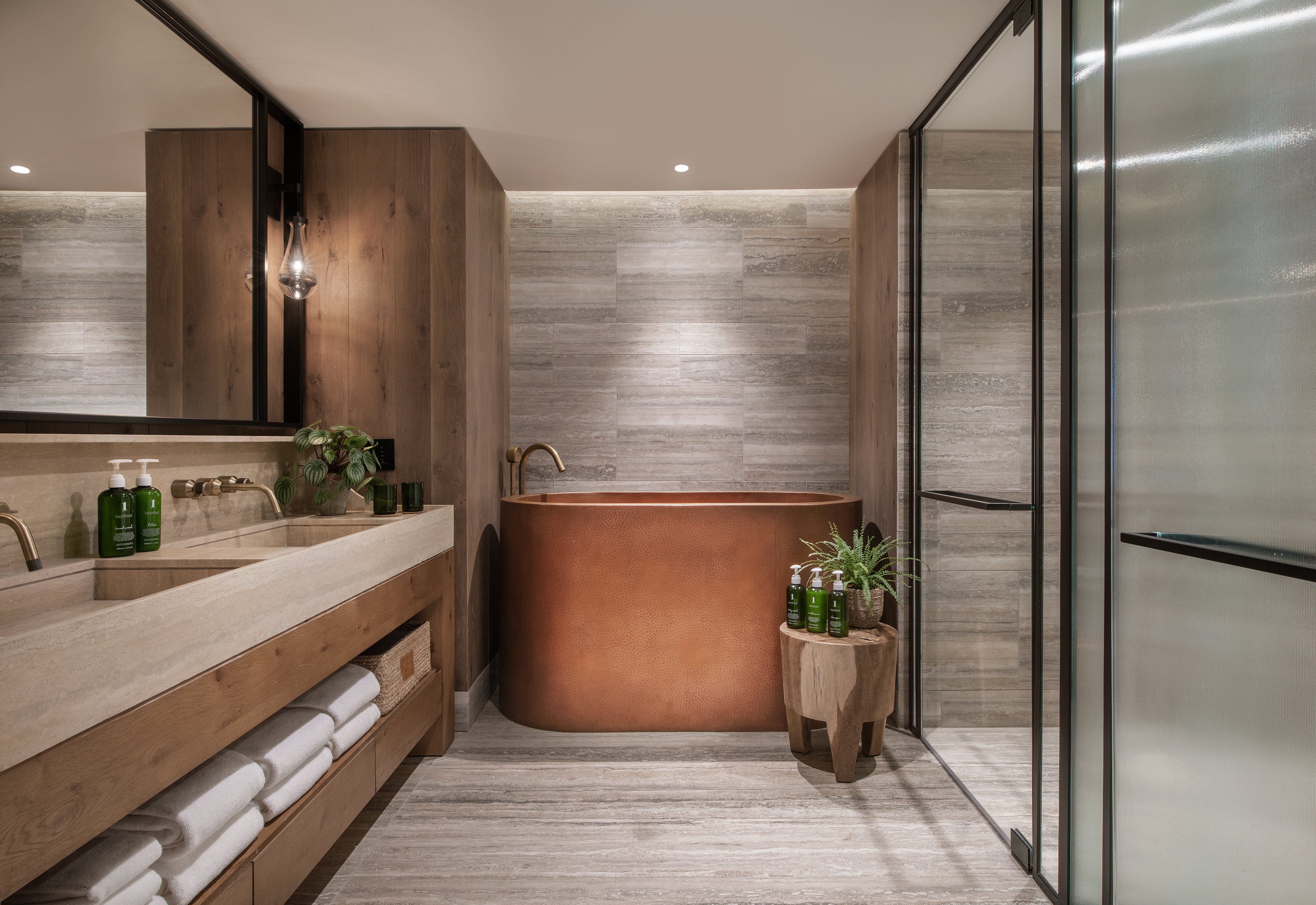 Bathroom with a deep copper tub