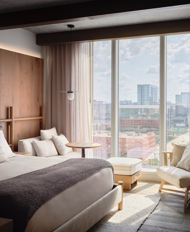 Wide windows allow in plenty of natural light, bathing the king size bed in sun