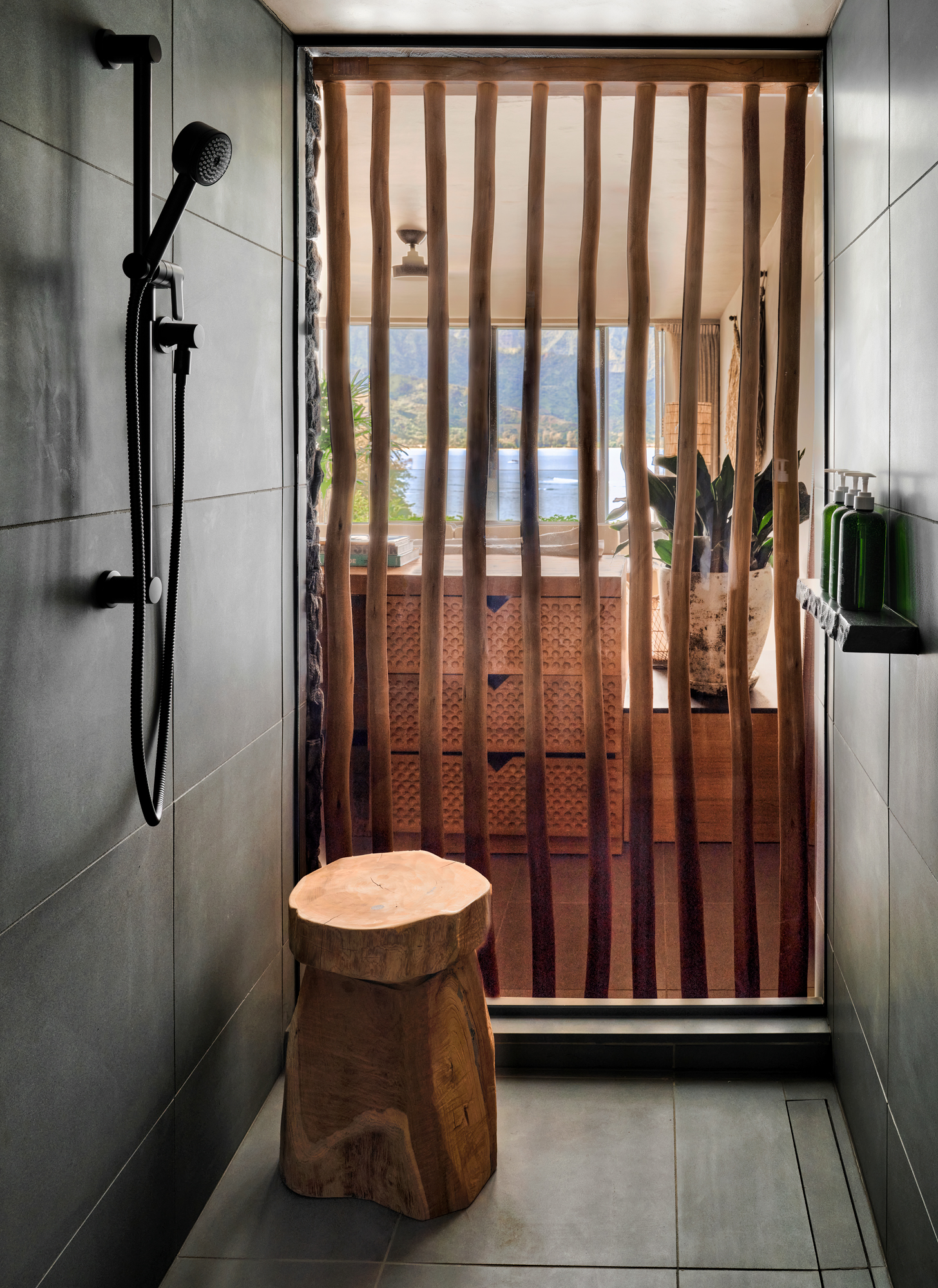 Bathroom shower area with a decorative bamboo door