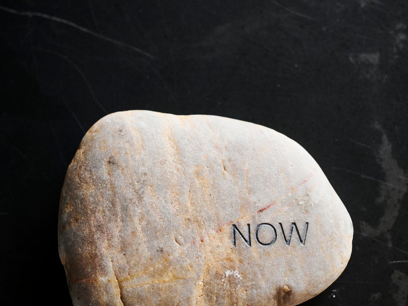 Rock with the word "now" carved into it