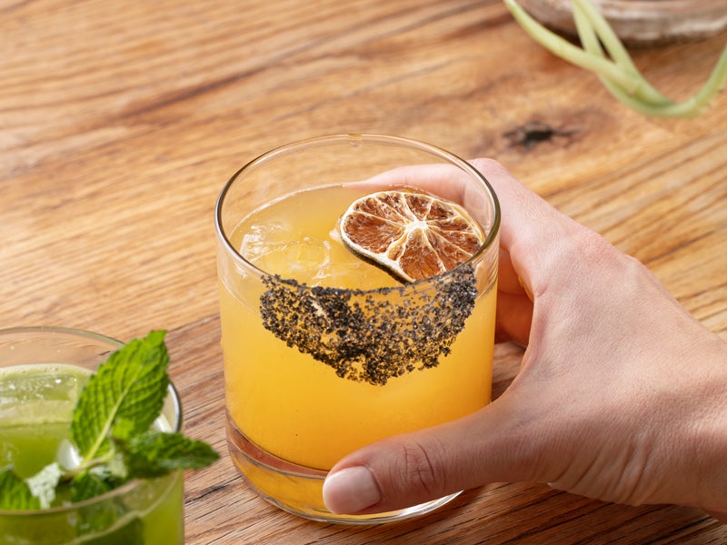 Man serving two cocktails