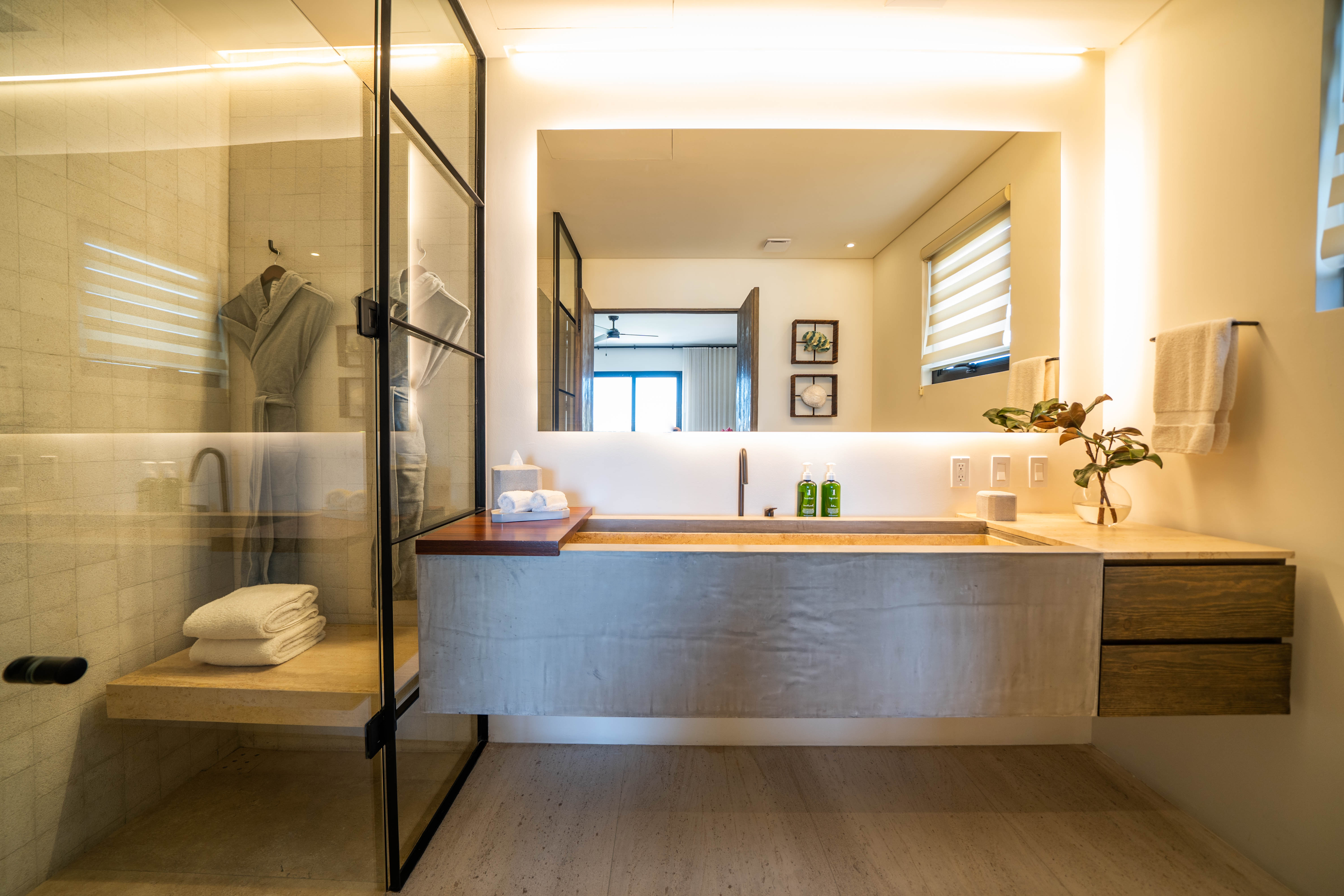 A sink next to a shower in the bathroom