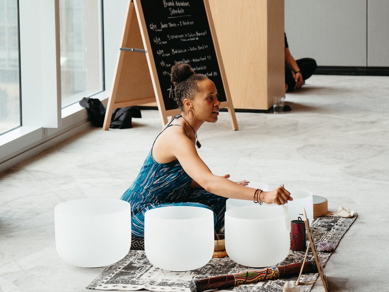 Woman leading a holistic ceremony
