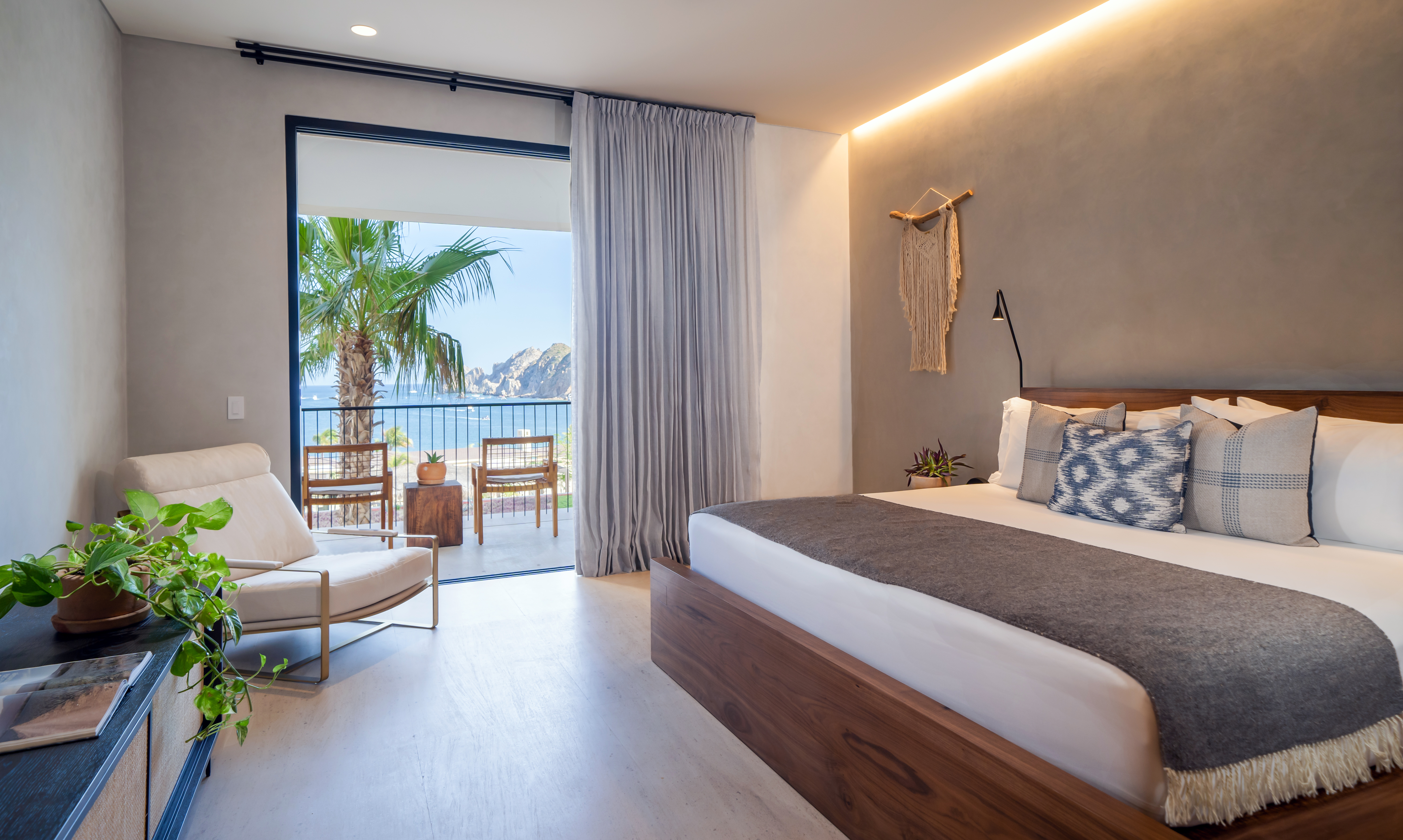 King bedroom with views of the ocean from a private patio