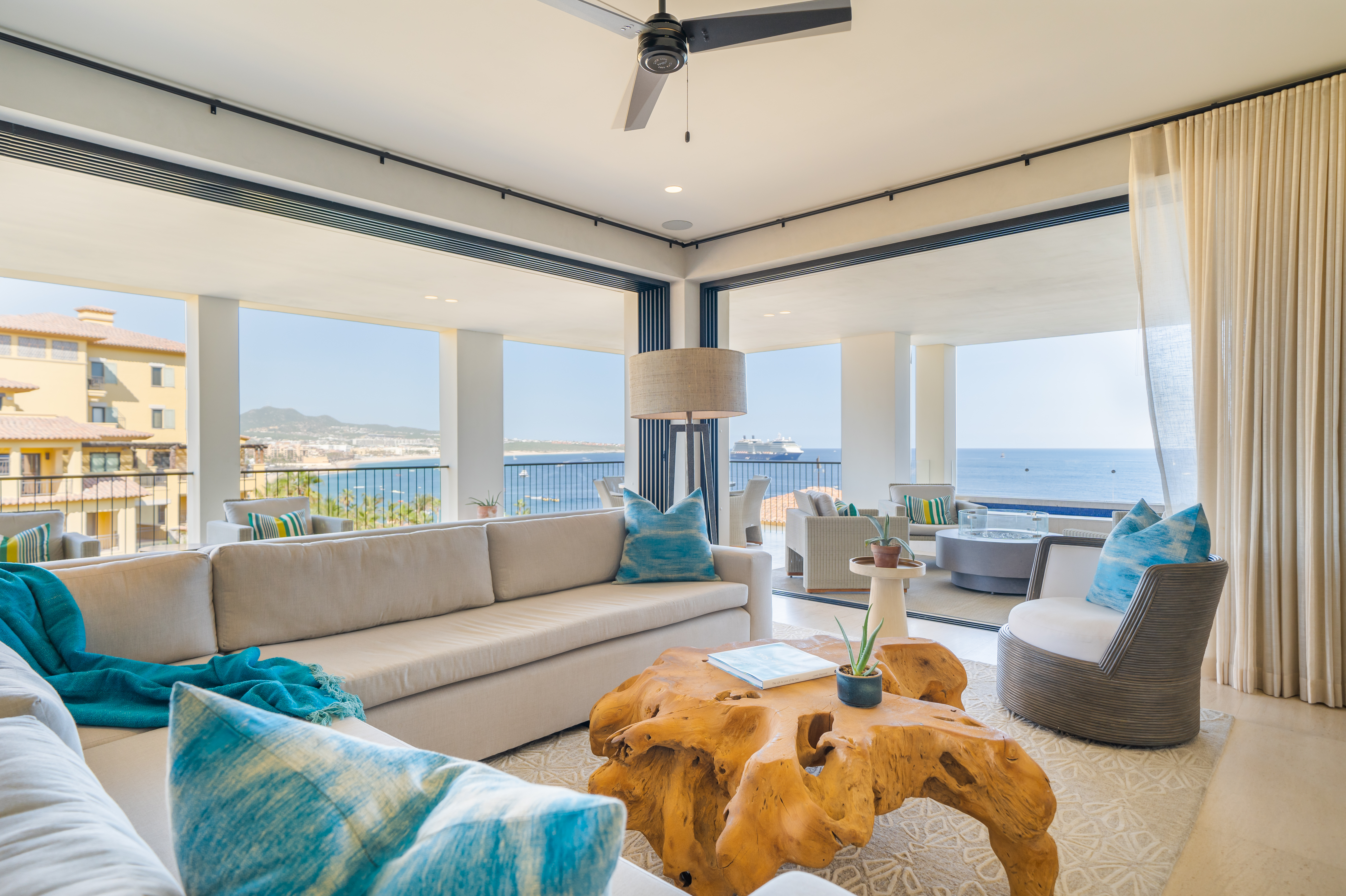 A living room with a wooden centerpiece and a sectional couch