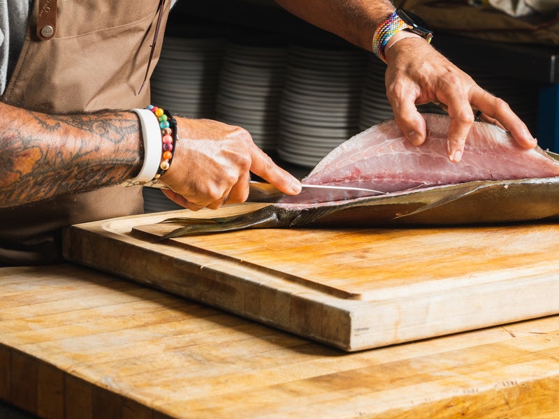 a chef preparing fish