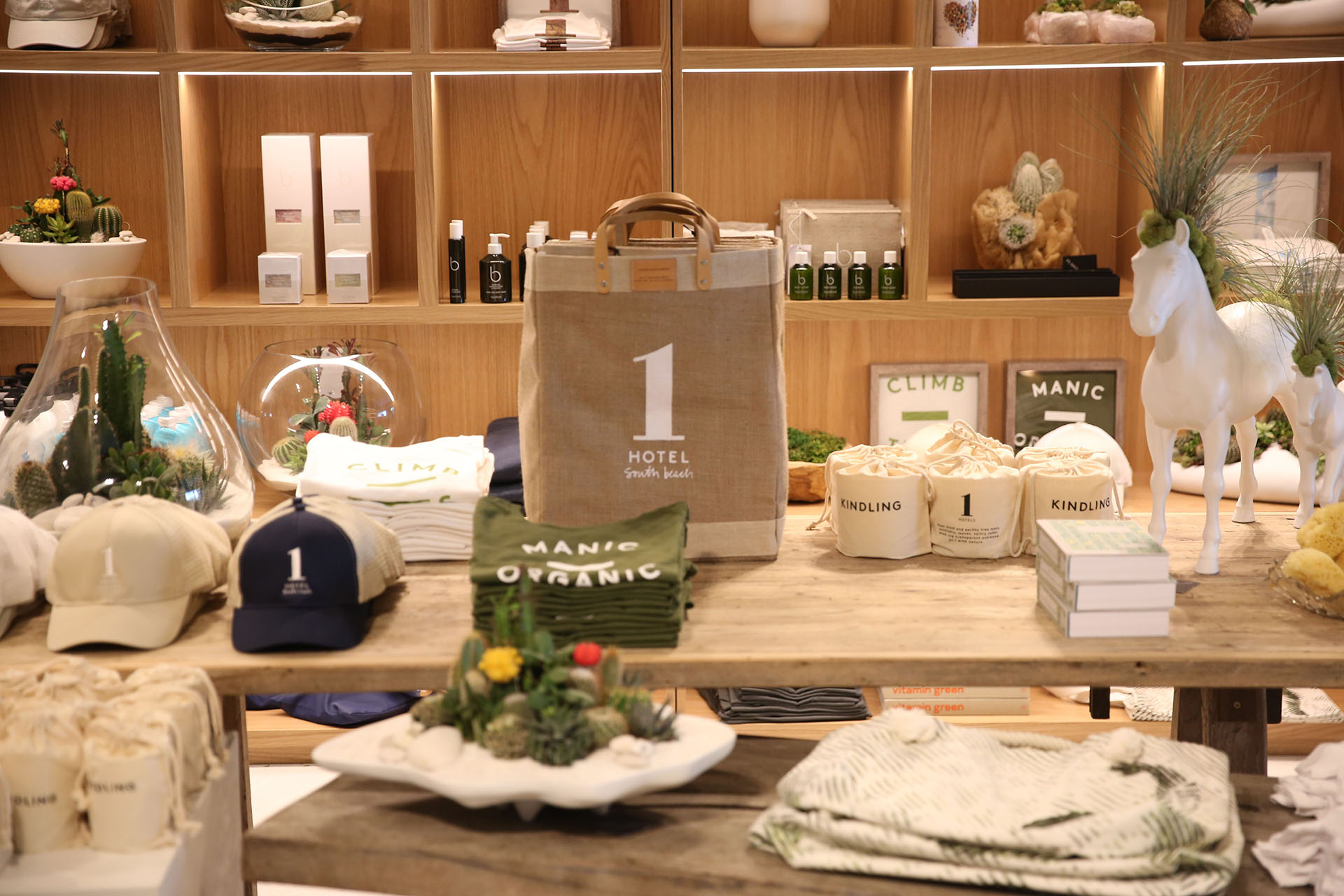 A display at a store with bags, hats and candles