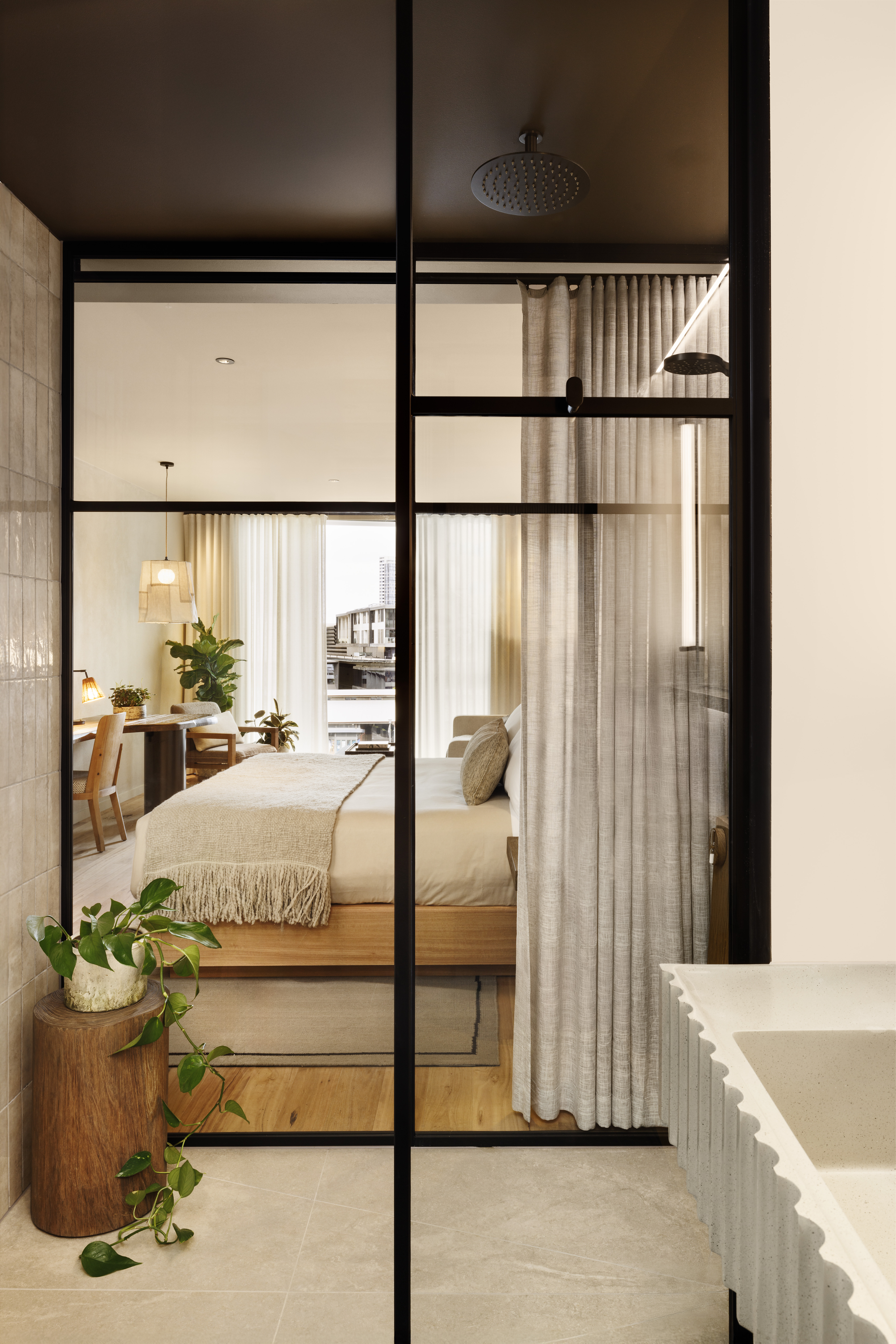 View of bedroom through glass wall