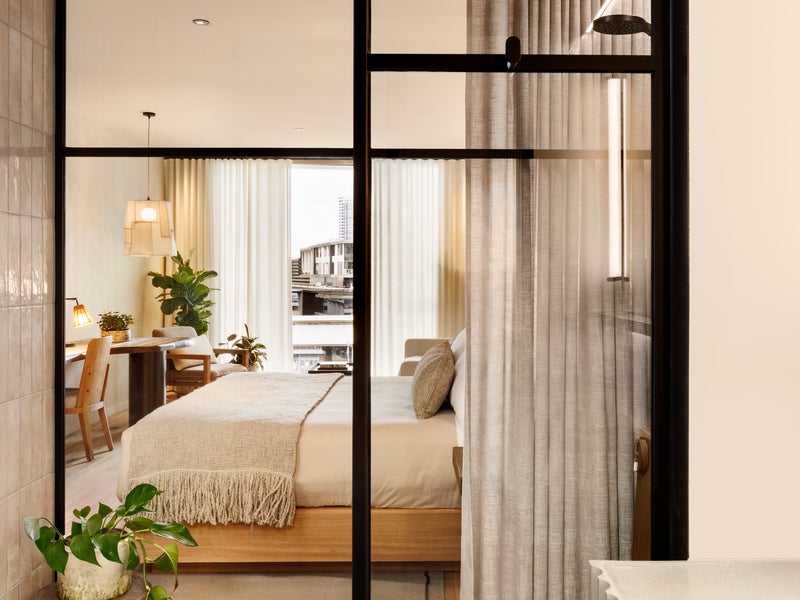 View of bedroom through glass wall