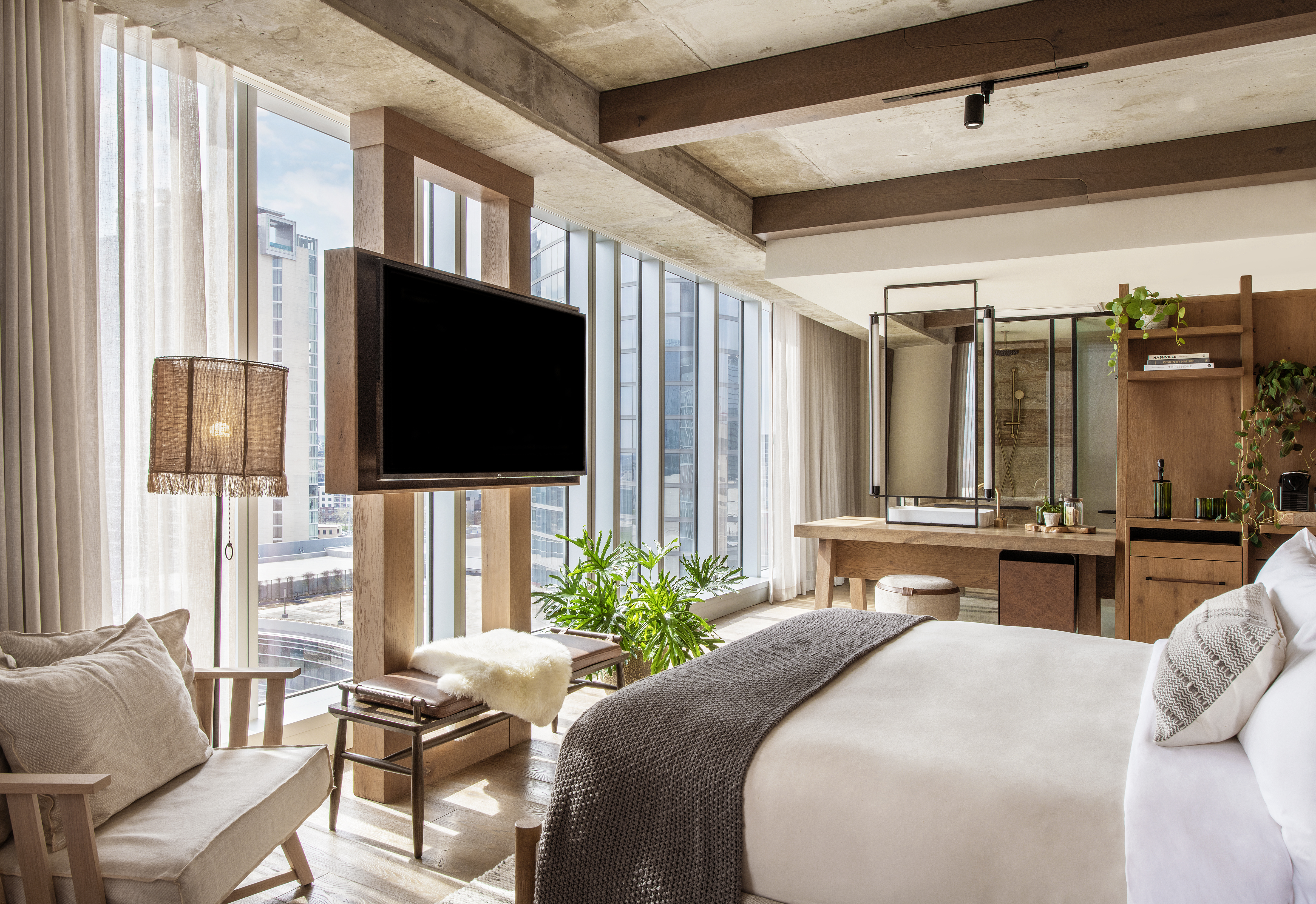 hotel room with floor to ceiling windows