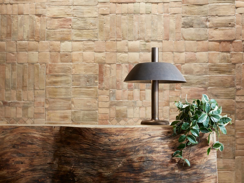 Grey lamp sitting on a lobby desk