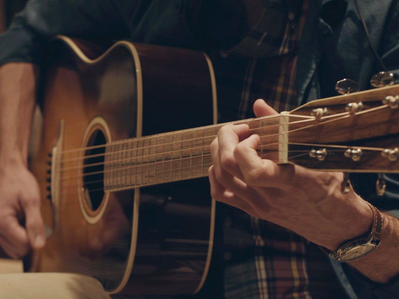 Person playing guitar
