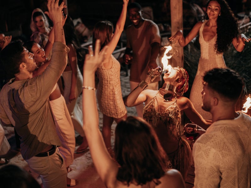 People dancing in sand