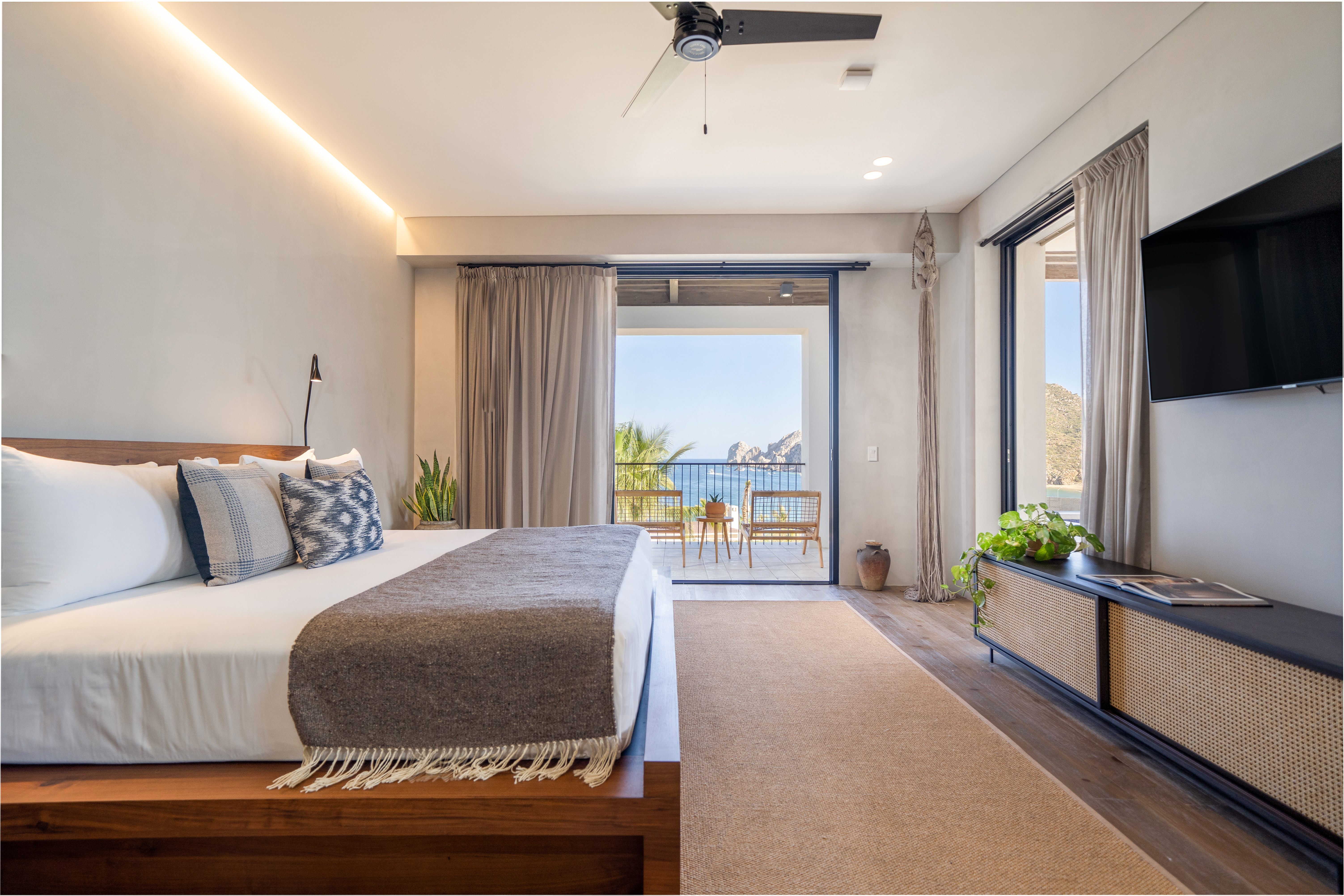 Made bed on a raised wooden frame