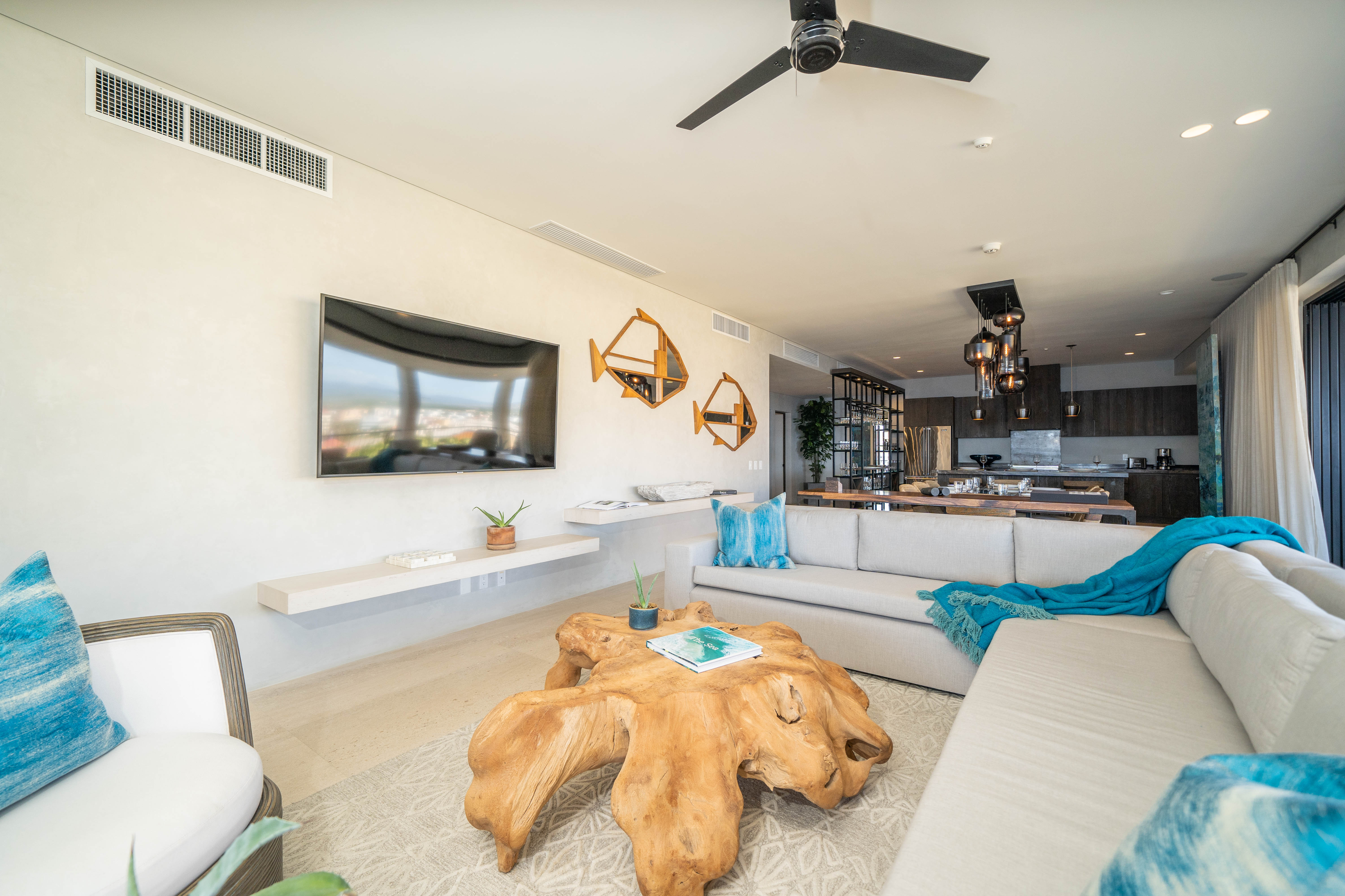 Living room with a wooden centerpiece and a sectional couch
