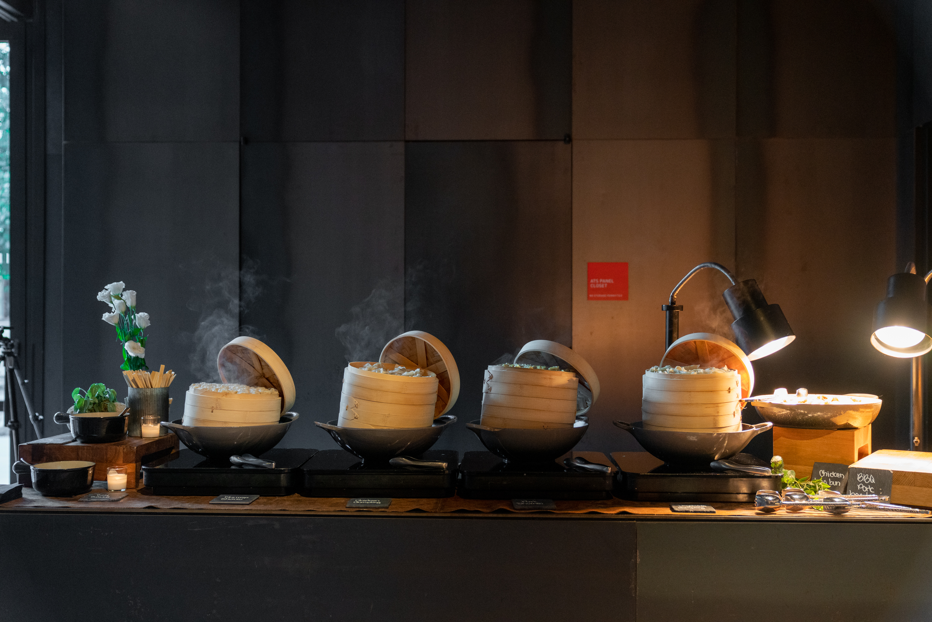 Four dishes of steaming food