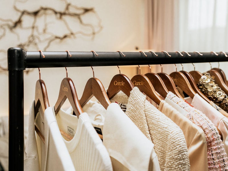 Fresh clothes on clothing hangers