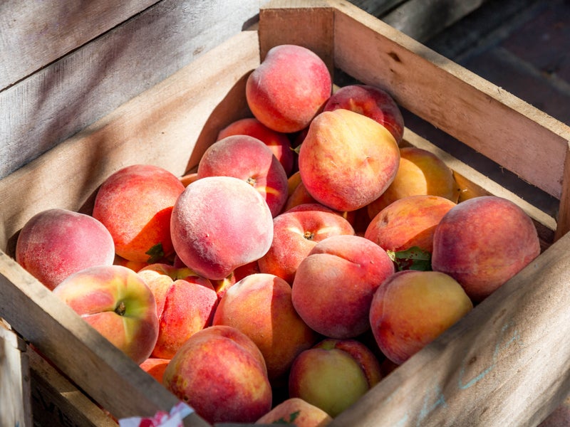 Peaches in a wood crate